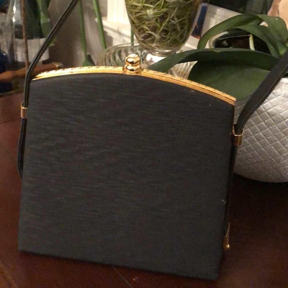 Satin structured evening bag with adjustable straps in black with gold accents